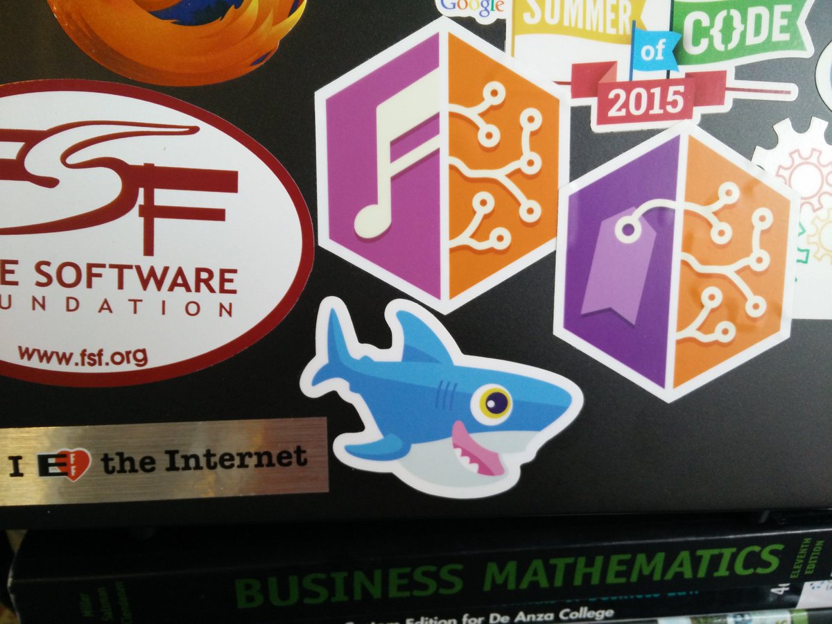 Laptop showing a DigitalOcean-ish shark sticker