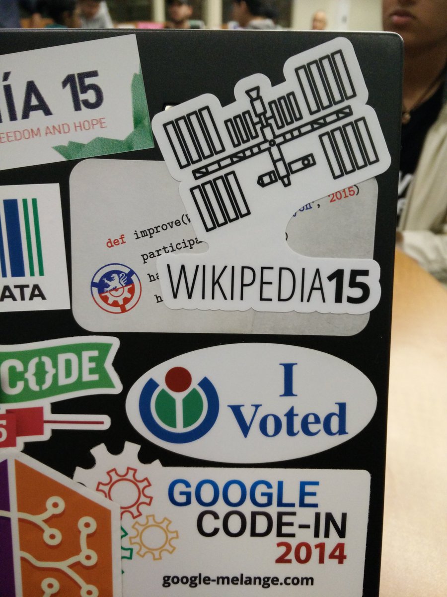 Laptop showing a "Wikipedia15" sticker with the International Space Station