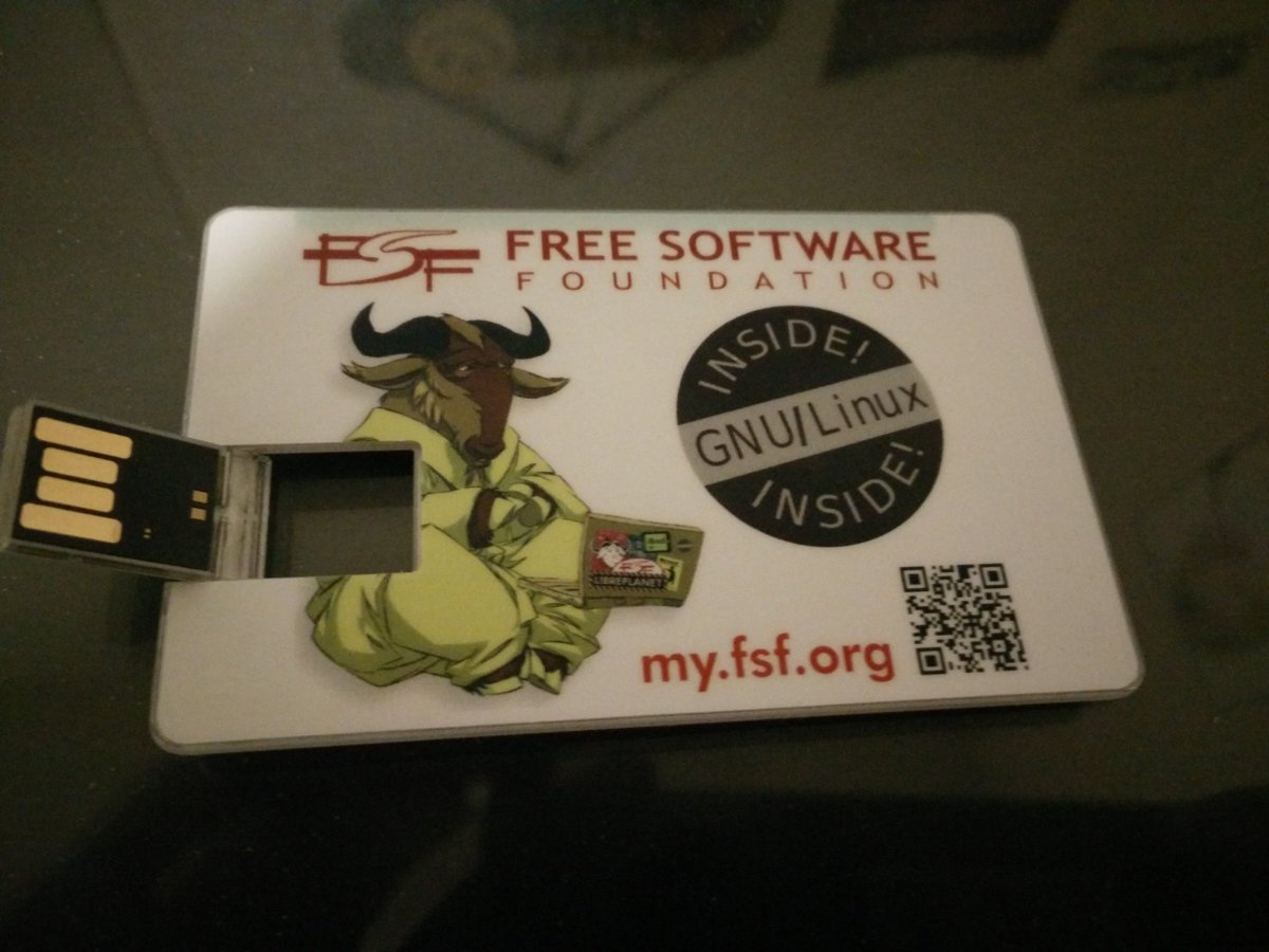 Picture of a USB card that says "GNU/Linux Inside"