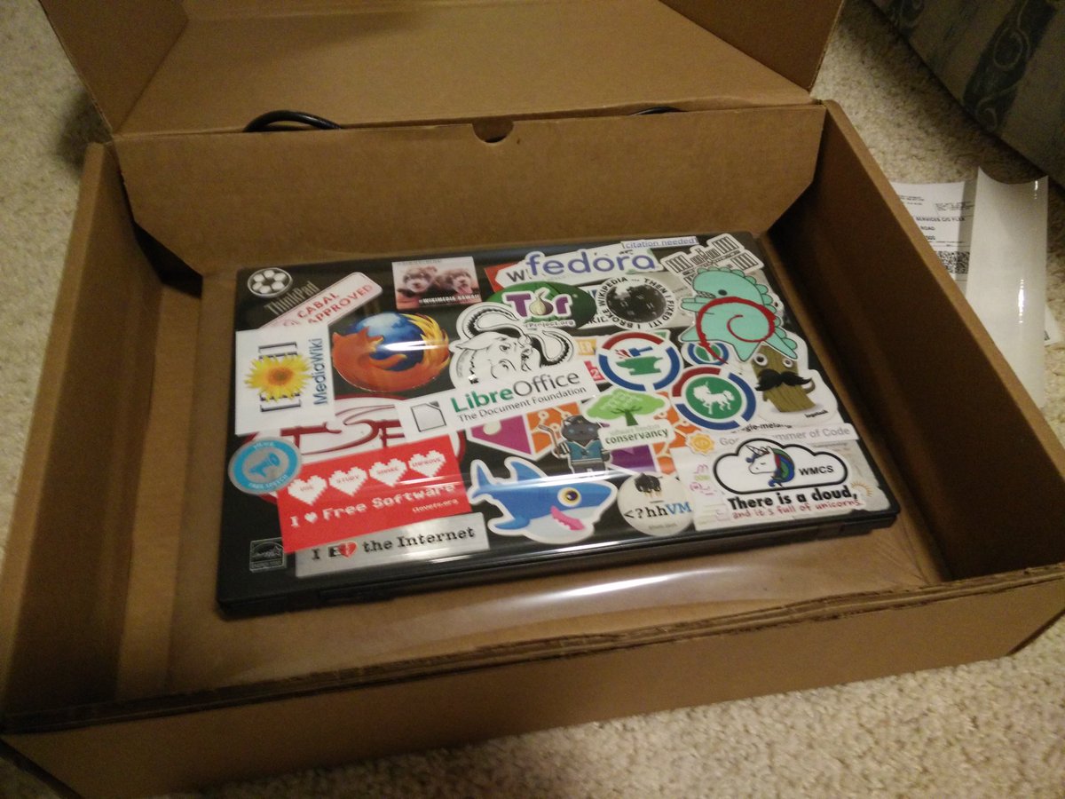 Picture of my laptop shrinkwrapped in a cardboard box