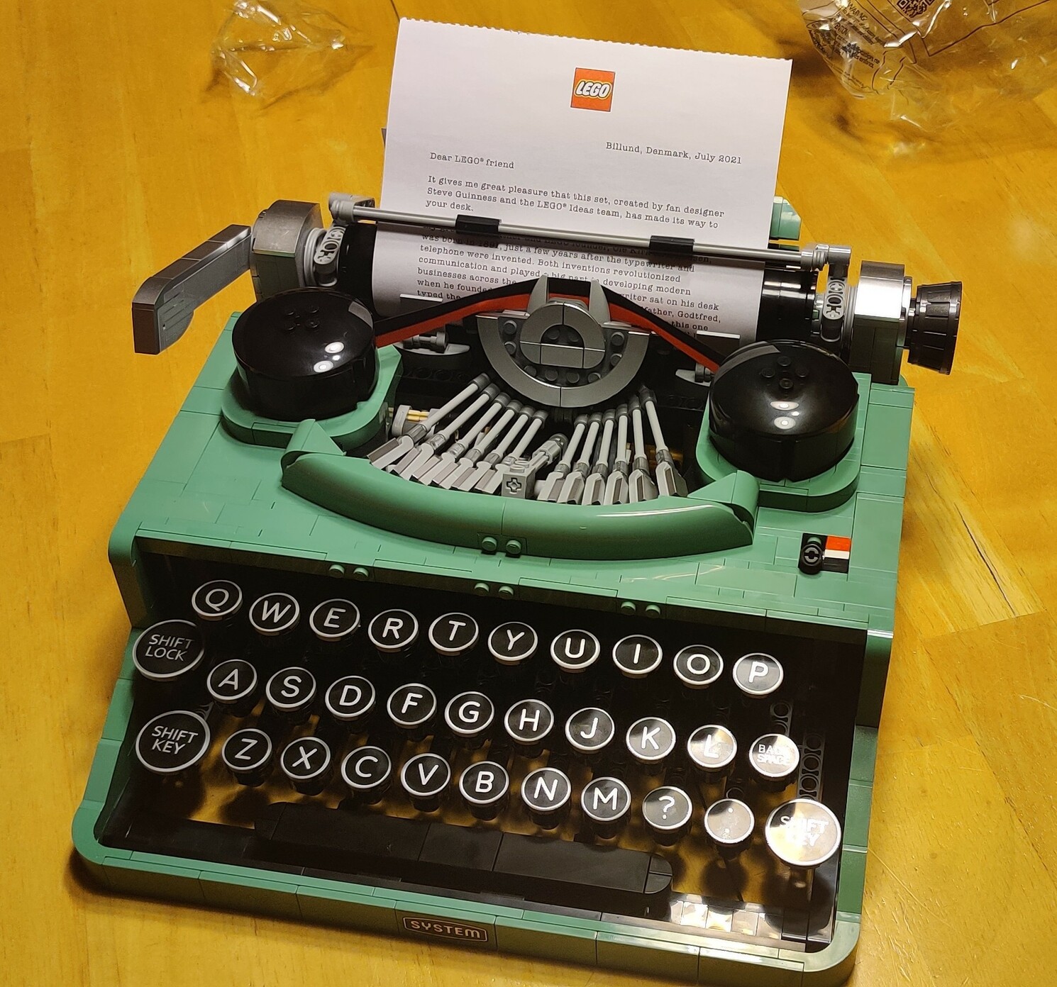 A green typewriter made out of LEGOs.